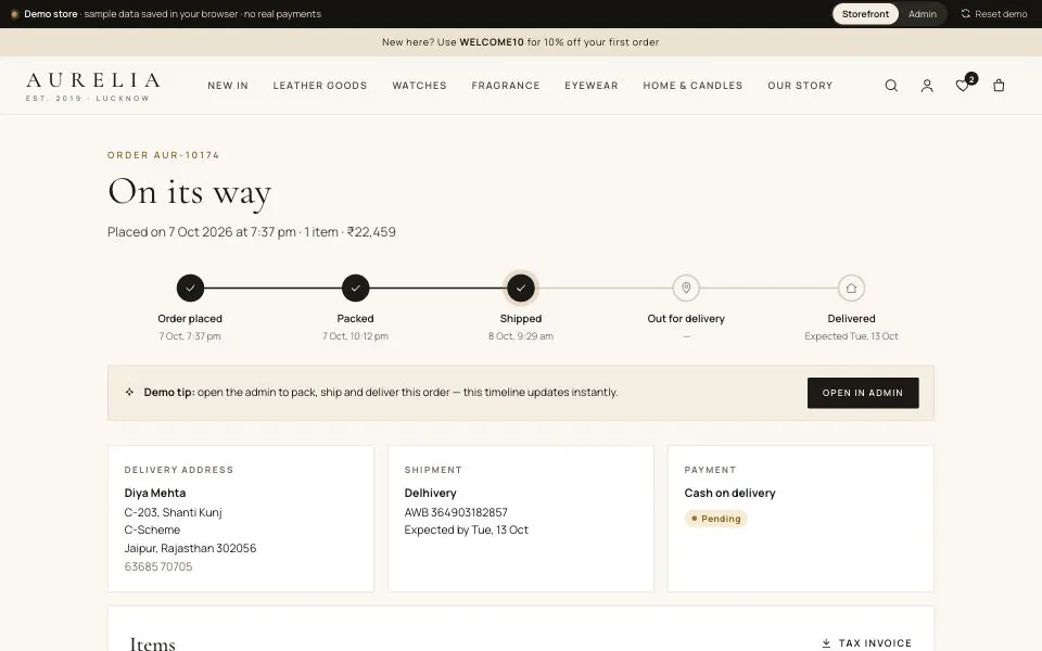 Aurelia order tracking page for a shipped order, showing a placed, packed and shipped timeline, the Delhivery courier with its AWB number, the delivery address and a pending cash-on-delivery payment